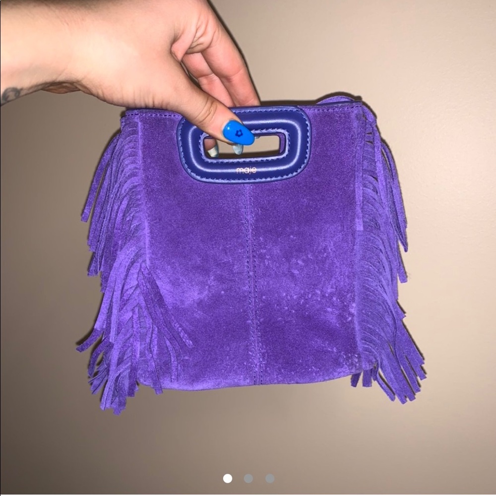 Maje mini bag also comes with silver strap